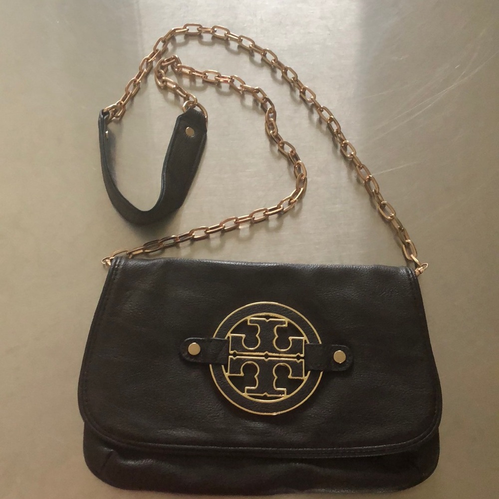 Small brown “Tory Burch” cross body bag.